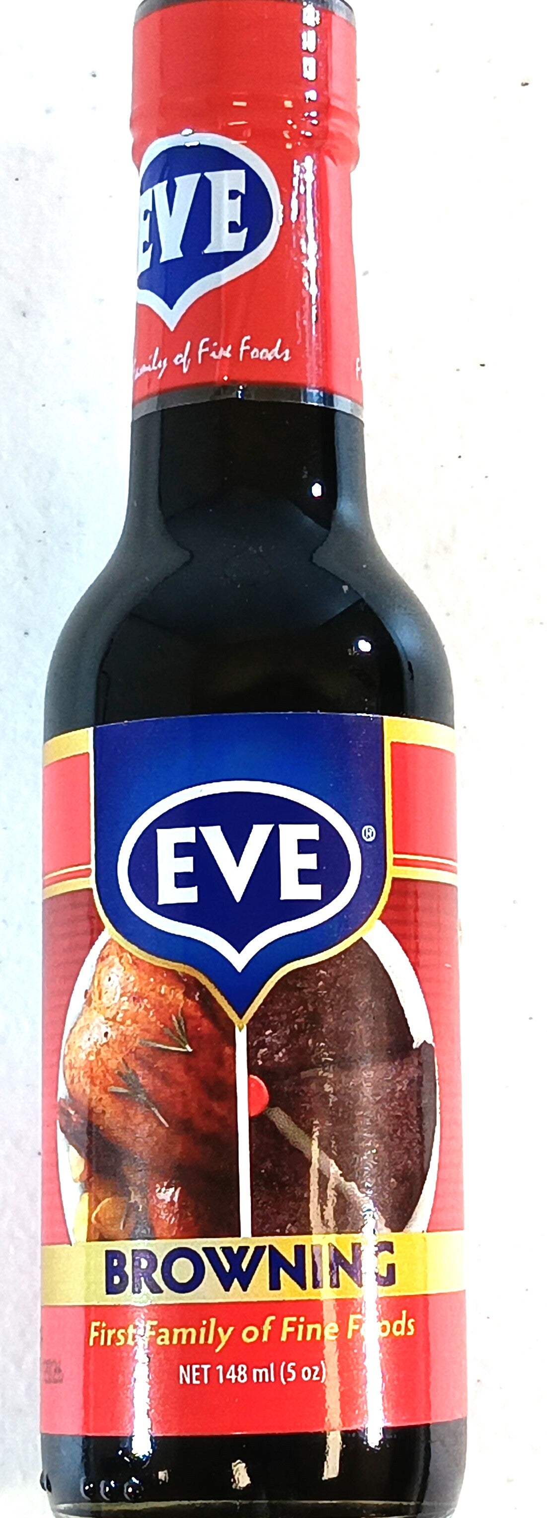 A 148 ml Eve Browning sauce bottle from TOJ EXPRESS, with a red and yellow label and a blue oval showcasing EVE, features images of cooked meat and declares itself the First Family of Fine Foods. This essential kitchen tool enhances cooking efficiency.
