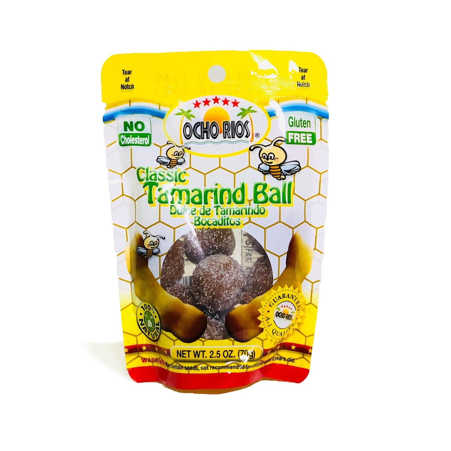 A 2.5 oz. package of TOJ EXPRESSs Ocho Rios Tamarind Ball highlights No Cholesterol and Gluten Free on a honeycomb pattern. This flavorful snack is wrapped in a yellow package featuring tamarind pod illustrations, promising a delightful treat.