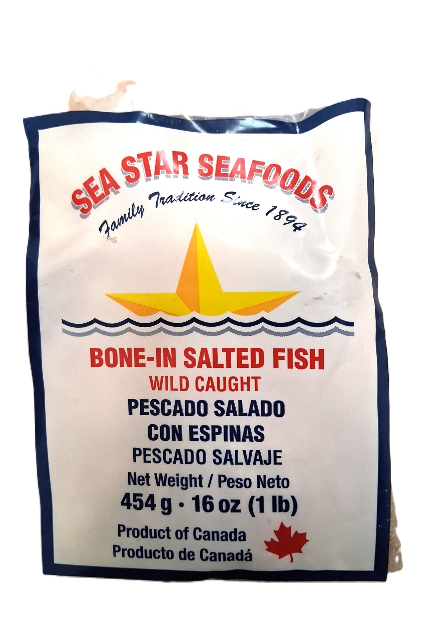 The Sea Star Seafoods Bone-In Salt Fish package by TOJ EXPRESS features a yellow star and boasts wild-caught, bone-in salted cod. Ideal for seafood lovers, the bilingual packaging in English and Spanish showcases the products weight and Canadian origin.