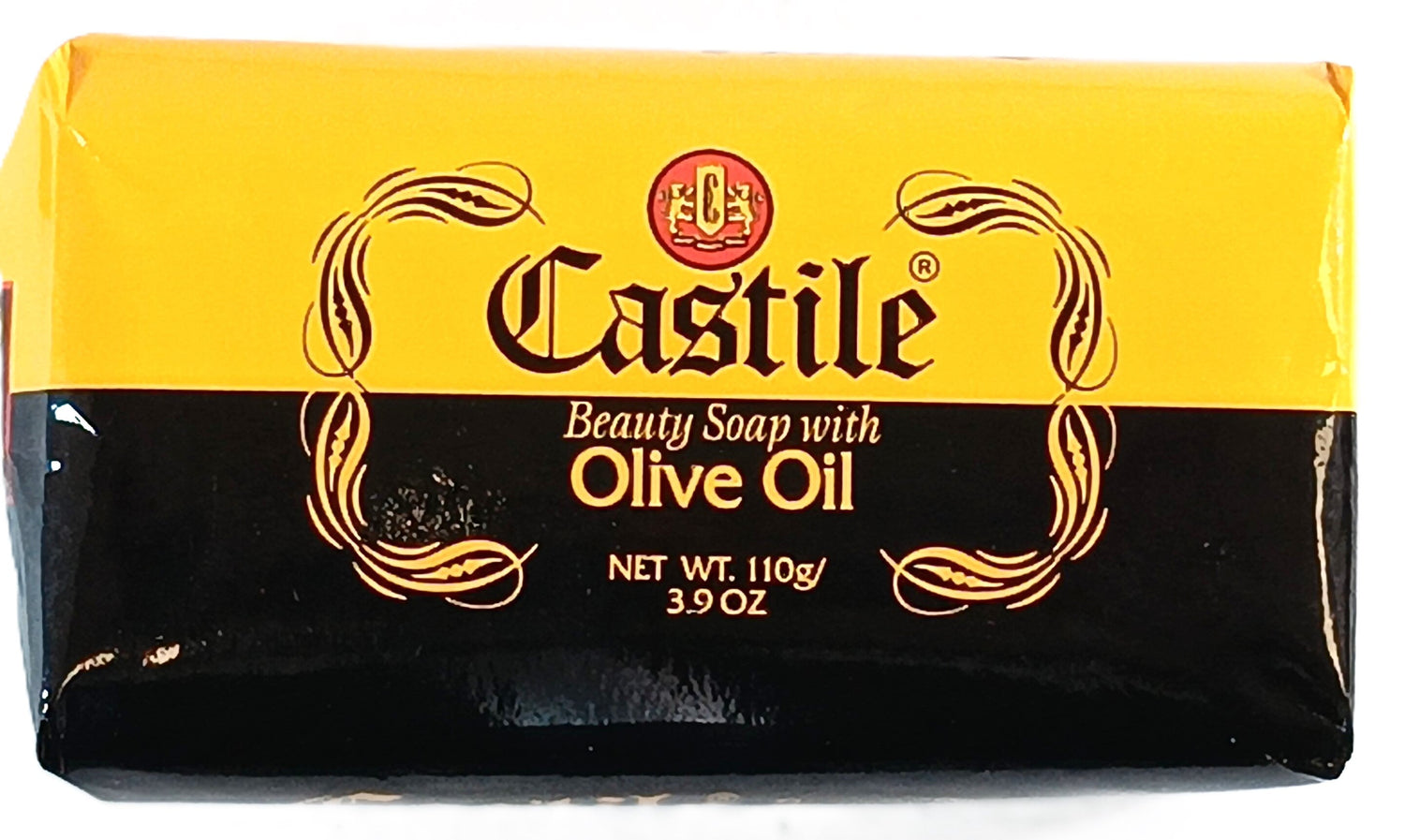 A bar of Castile Beauty Soap with Olive Oil. The packaging is black and yellow with the text 3.9 oz, NET WT. 110g displayed on the front. Decorative swirls adorn the label.