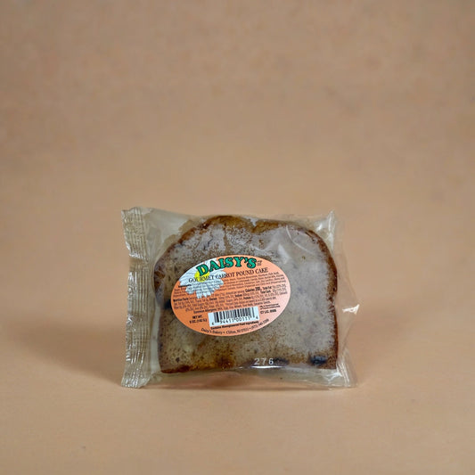 Packaged loaf of bread with a label on a beige background
