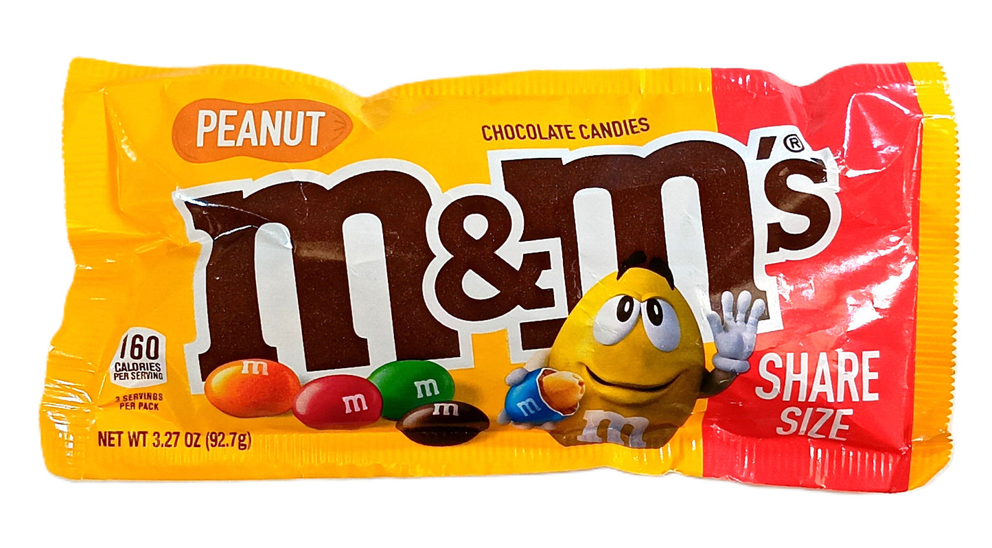 A colorful 3.27 oz yellow and red package of TOJ EXPRESS M & M Chocolate Candy (Peanut) features the waving yellow M&M character. Labeled Share Size, this treat blends real milk chocolate with a candy shell, providing 60 calories per serving.