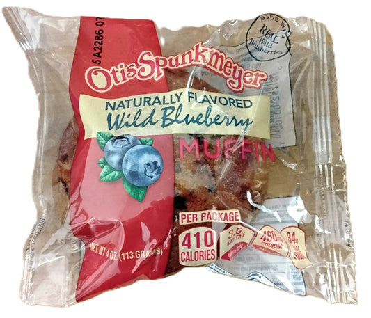 Packaged muffin with Otis Spunkmeyer branding and wild blueberry flavor indication.