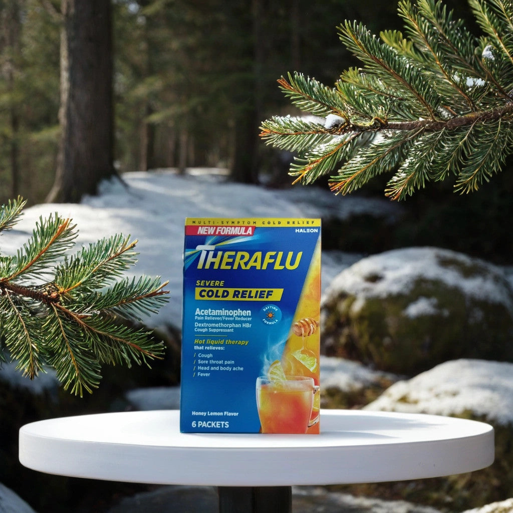 A box of TheraFlu by TOJ EXPRESS sits on a round white table outdoors, surrounded by snowy pine branches and trees, promising powerful congestion relief amid a wintry forest path in the background.