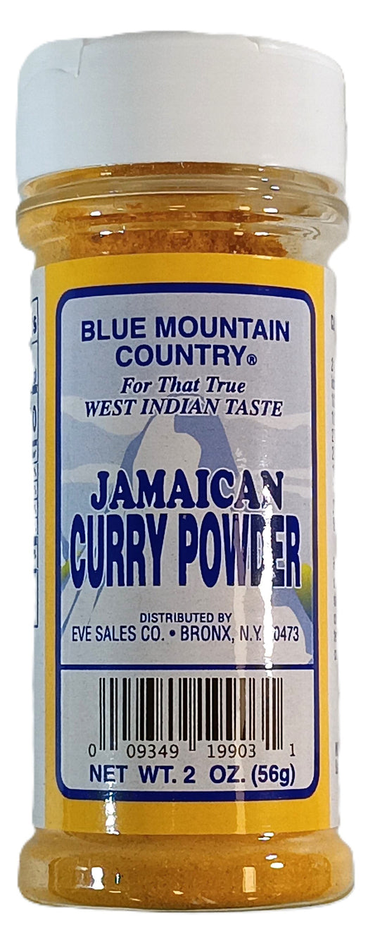 A clear plastic jar labeled Blue Mountain Curry -2oz (Mild), with a yellow lid, contains 56g of mild curry powder. Distributed by TOJ EXPRESS, Bronx, NY.