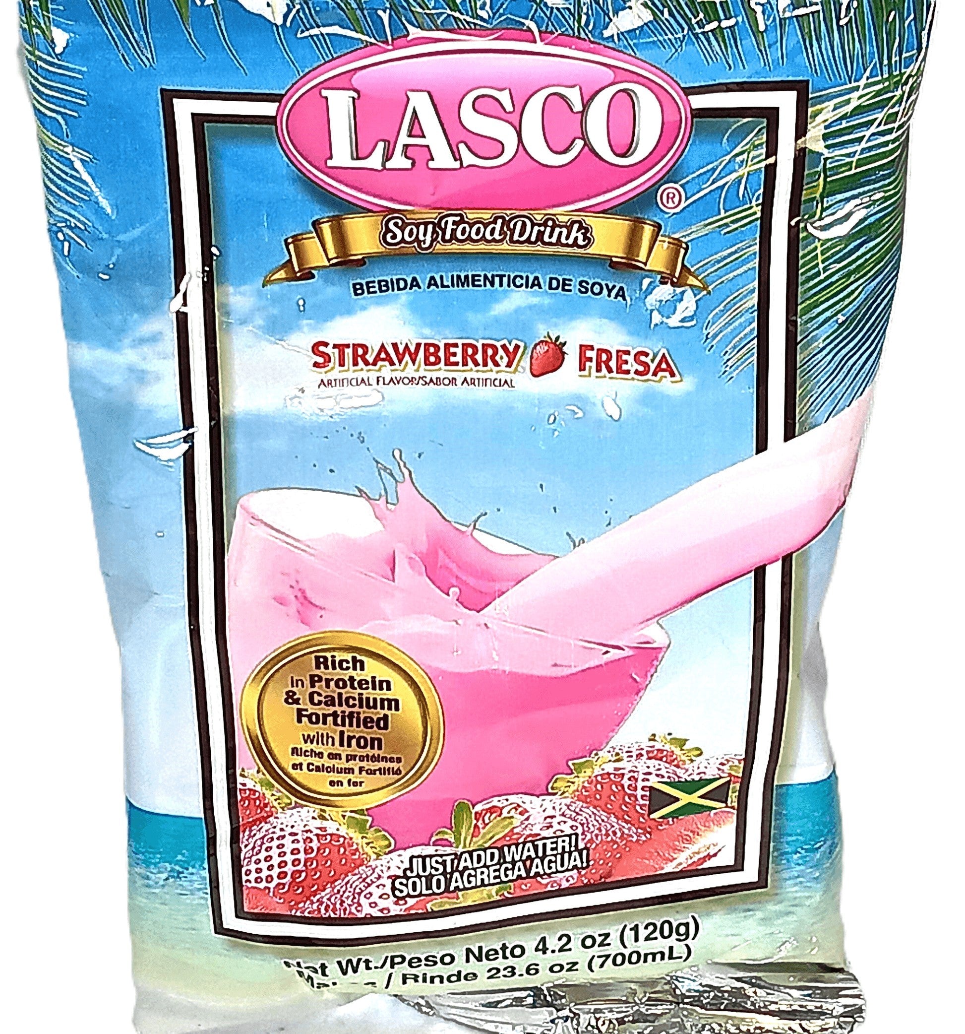 A packet of TOJ EXPRESS Lasco Strawberry Drink – Plant-Based, Soy-Infused; a ready-to-drink strawberry beverage with protein, calcium, iron, and a hint of pink. Features product details and a small Jamaican flag on the label.