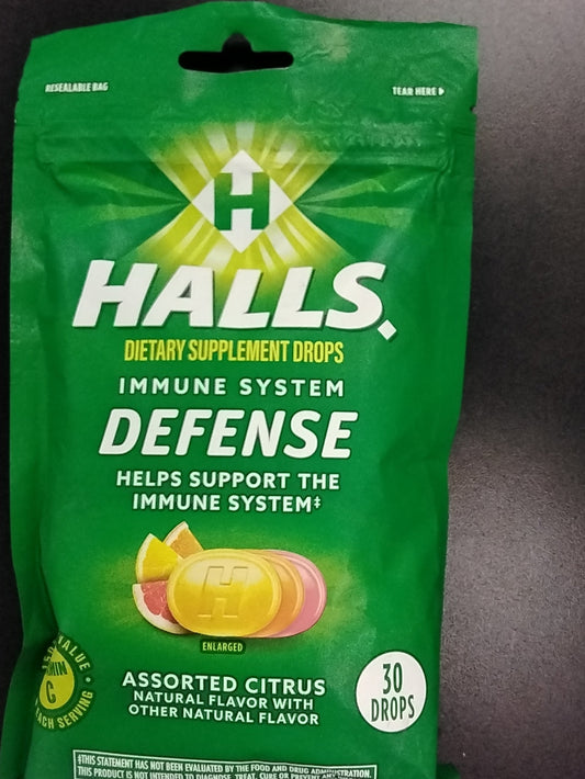 A green pack of TOJ EXPRESS Halls IMMUNE DEFENSE DROPS 30 CT, assorted citrus flavor, showing drops and fruit slices. Contains 30 drops and supports immune health and wellness.