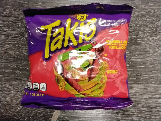 A small bag of TOJ EXPRESS Takis-Nitro spicy tortilla chips, with bold purple and red packaging featuring rolled chips and a green lime slice on a dark wooden surface.