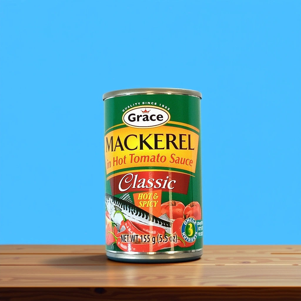 A can of TOJ EXPRESS Grace Mackerel Tomato Sauce-Hot & Spicy sits on a wooden surface against a blue backdrop, its green label displaying mackerel, tomatoes, and peppers with the text Classic Hot & Spicy.